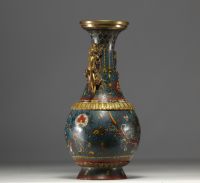 China - A Qing-period cloisonné vase with dragon decoration and bronze handles.