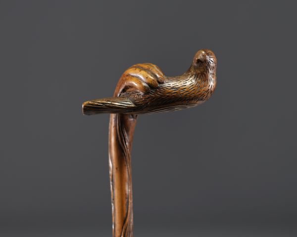 Art Populaire - Carved wooden cane with a hand holding a bird, fully carved shaft.