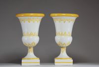 A pair of glazed ceramic Medici vases with floral decoration in relief and Latin script, late 18th century.