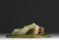 Amalric WALTER (1870-1959) - Sculpture in pink and green glass paste in high relief depicting a young girl lying in the waves, signed.