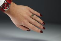 Ring set with diamonds, sapphire, rubies and emeralds in 18k gold weighing 5.2gr.