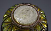 DAUM Nancy et Louis MAJORELLE (1859-1926) Blown and moulded glass bowl with gold leaf inclusions, hammered wrought iron mount, signed.