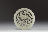 China - Carved jade disc pendant with a magpie on a plum blossom, 18th century.