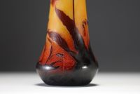 DAUM Nancy - Vase in acid-etched multi-layered glass decorated with flowers and tobacco leaves, signed in the decoration.