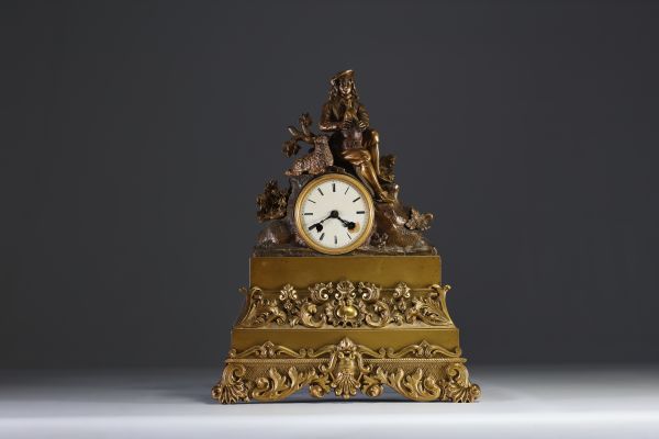 Pendule en bronze doré et patiné figurant un berger et son mouton, XIXème.