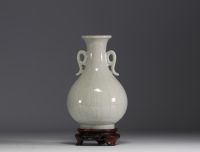 China - Monochrome porcelain vase on wooden base, blue mark under the piece.