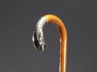Art Deco silver cane with panther head motif, glass eyes, hallmark 800, Switzerland.