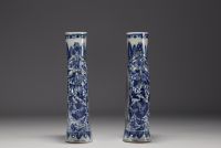 China - Pair of blue-white gourd vases decorated with figures at play, chimera handles, 19th century.