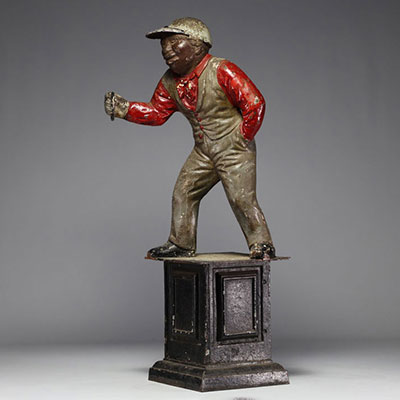 Polychrome cast iron horse clip depicting a stable boy, circa 1900/20.