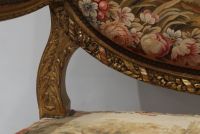 Important set of carved and gilded wood salon furniture, fine Aubusson tapestry including a sofa and a suite of four bergère armchairs, 19th century.