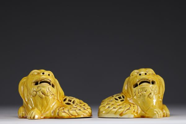Asian- Pair of yellow porcelain figurative incense burners depicting dogs.