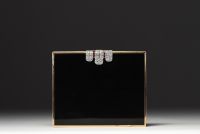 VAN CLEEF & ARPELS - Rare minaudière in black lacquer and 18k gold, clasp adorned with diamonds and rubies.