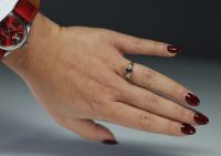 Ring in 14k gold set with two diamonds and a sapphire weighing 1.8gr.
