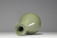 China - Monochrome porcelain vase with floral decoration in relief, 19th century.