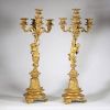 Très belle paire de candélabres à cinq feux en bronze doré et patiné à décor de faune et faunesse, XIXème.