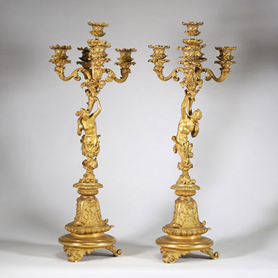Très belle paire de candélabres à cinq feux en bronze doré et patiné à décor de faune et faunesse, XIXème.