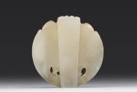 China - Taotie mask in carved green jade.