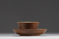 China - Porcelain bowl and plate with internal floral and capuchin decoration, 18th century.