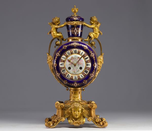 A rare Sèvres porcelain and gilt bronze clock decorated with cherubs.