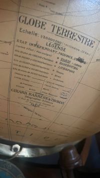 GIRARD & BARRERE, Paris - Luminous glass globe, tripod mahogany base, zodiac signs on wooden belt, circa 1930