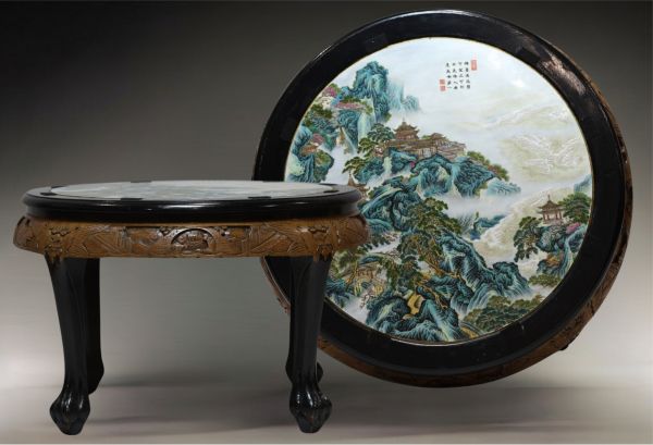 China - Table with carved wooden base and polychrome porcelain top depicting a tower in a mountain landscape, Republic period.