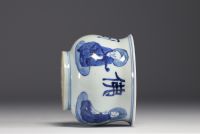 China - White and blue porcelain brush with sage decoration.