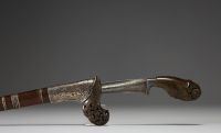 Malaysia - Kriss, horn handle, wooden and silver scabbard, hammered steel blade, 19th century.
