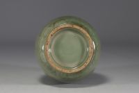 China - Celadon monochrome porcelain vase with floral design in relief.