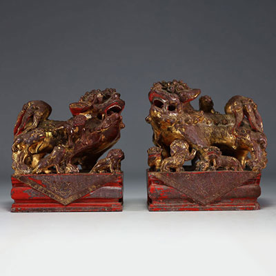 China - Pair of gilded and polychromed carved stone Fô dogs, 18th century.