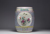 China - A famille rose porcelain stool decorated with peonies and birds in cartouches, circa 1900