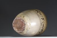 China - Cizhou glazed stoneware jar decorated with a floral frieze and calligraphy, Yuan-Ming.