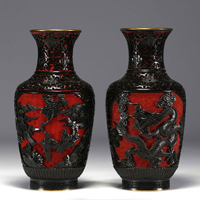 China - A pair of cloisonné vases with figures.