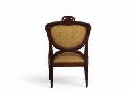 Fauteuil d'époque Art Nouveau en bois sculpté, avec dossier sculpté d'une tête de femme.