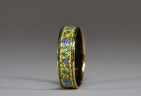 Hermès - Bracelet en plaqué or et émail imprimé à décors de vignes, dans son écrin d'origine, signé.