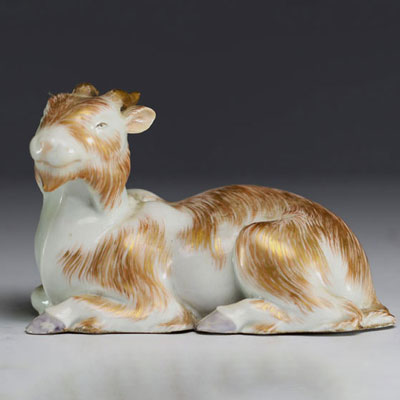 Asia - Resting goat in polychrome porcelain.