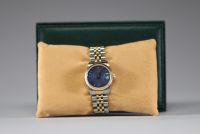 Rolex - Oyster Perpetual Datejust en acier et or jaune 18K, rare cadran bleu sérigraphié Rolex, 34 mm. Bracelet Rolex Jubilé en or jaune et acier, sur boucle déployante. Avec boîte Rolex