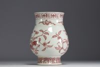 China - Iron-red porcelain vase decorated with fruit and bats, blue mark.