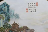 China - Table with carved wooden base and polychrome porcelain top depicting a tower in a mountain landscape, Republic period.