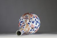 China - Polychrome porcelain vase decorated with a dragon, a phoenix and copper-red peony flowers, Qianlong period.