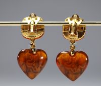 Yves SAINT LAURENT - Pair of heart-shaped earrings, imitation amber and gold-plated metal, signed.