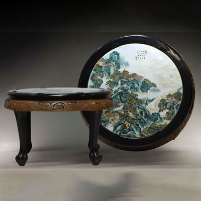 China - Table with carved wooden base and polychrome porcelain top depicting a tower in a mountain landscape, Republic period.