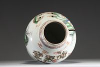 China - Covered vase in green family polychrome porcelain decorated with characters, circle mark under the piece.