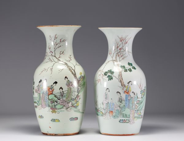 China - A pair of famille rose porcelain vases with courtesans, early 20th century.
