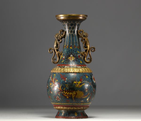 China - A Qing-period cloisonné vase with dragon decoration and bronze handles.