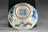 China - Set of three porcelain bowls decorated with roosters, hens and chicks in Ducaï enamels.