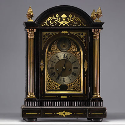 Mantel clock with striking mechanism in veneered wood, bronze and brass, 18th century.