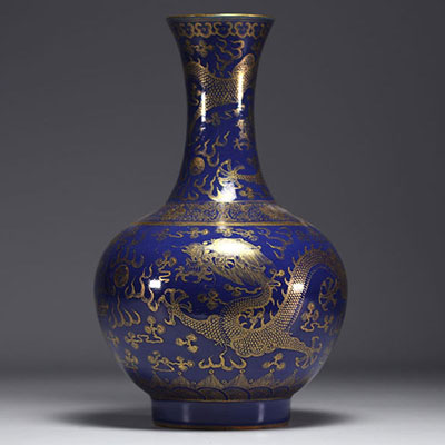 China - A powder blue and gold porcelain vase decorated with five-clawed dragons.