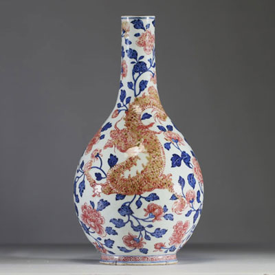 China - Polychrome porcelain vase decorated with a dragon, a phoenix and copper-red peony flowers, Qianlong period.