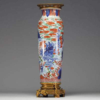 China - A polychrome porcelain vase with cloudy landscape and figures on a bronze frame, Transition period, 17th century.