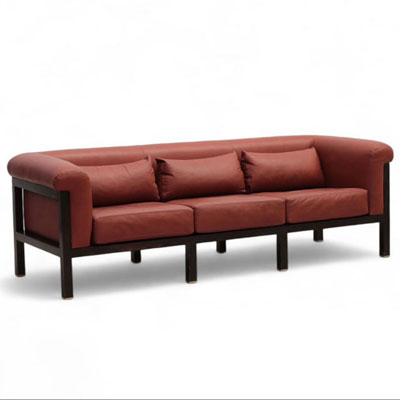 Jules WABBES (1919-1974) Three-seater sofa, black lacquered wood and red leather frame, brass base, circa 1960.
